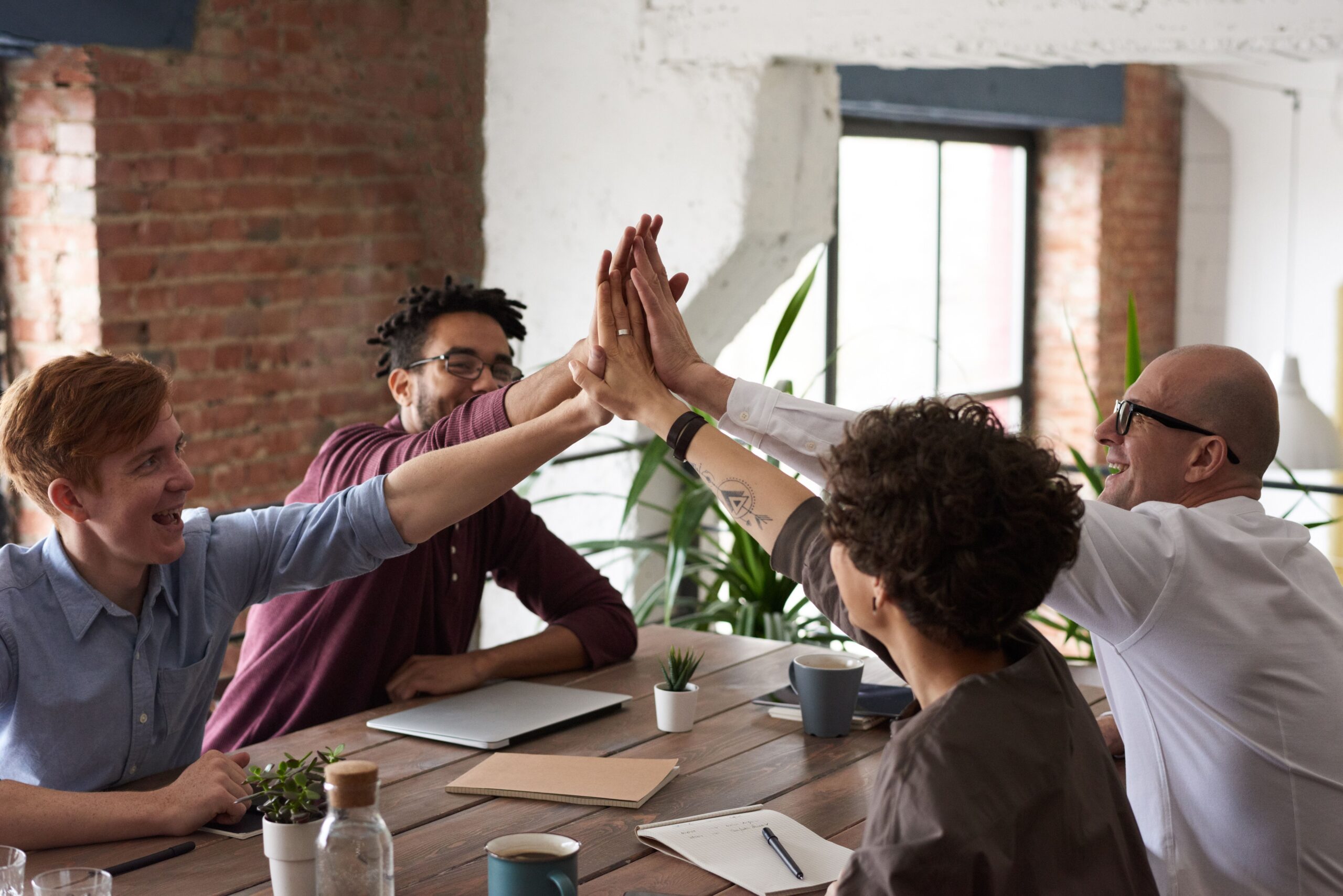 Team giving a high five, good recordkeeping policy and procedure
