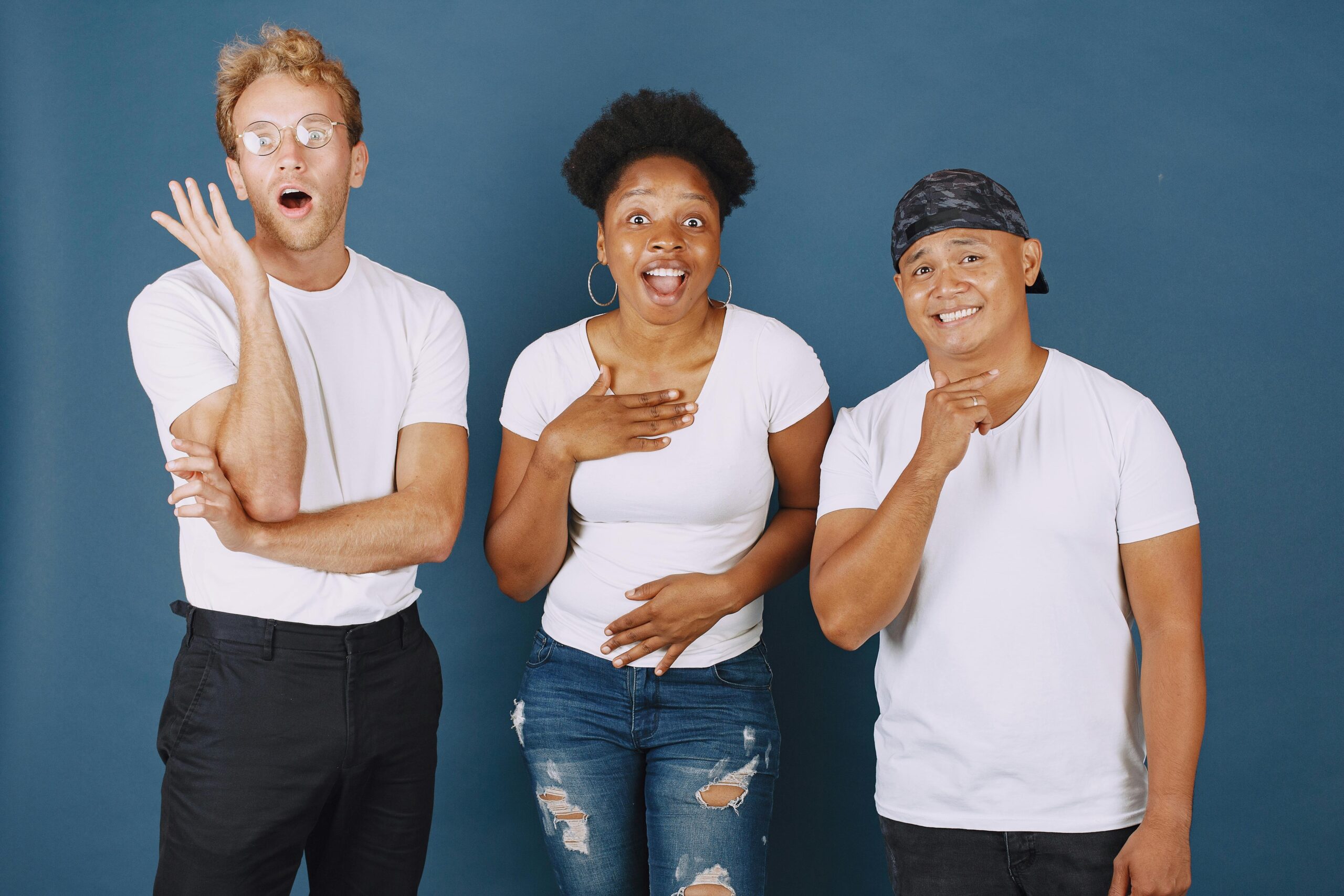 Diverse group of three people with surprised expressions, potential disability service providers in NZ