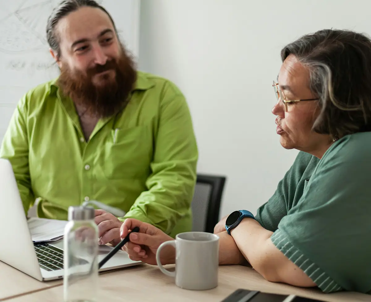 Two people discussing the how to respond to a failed audit.