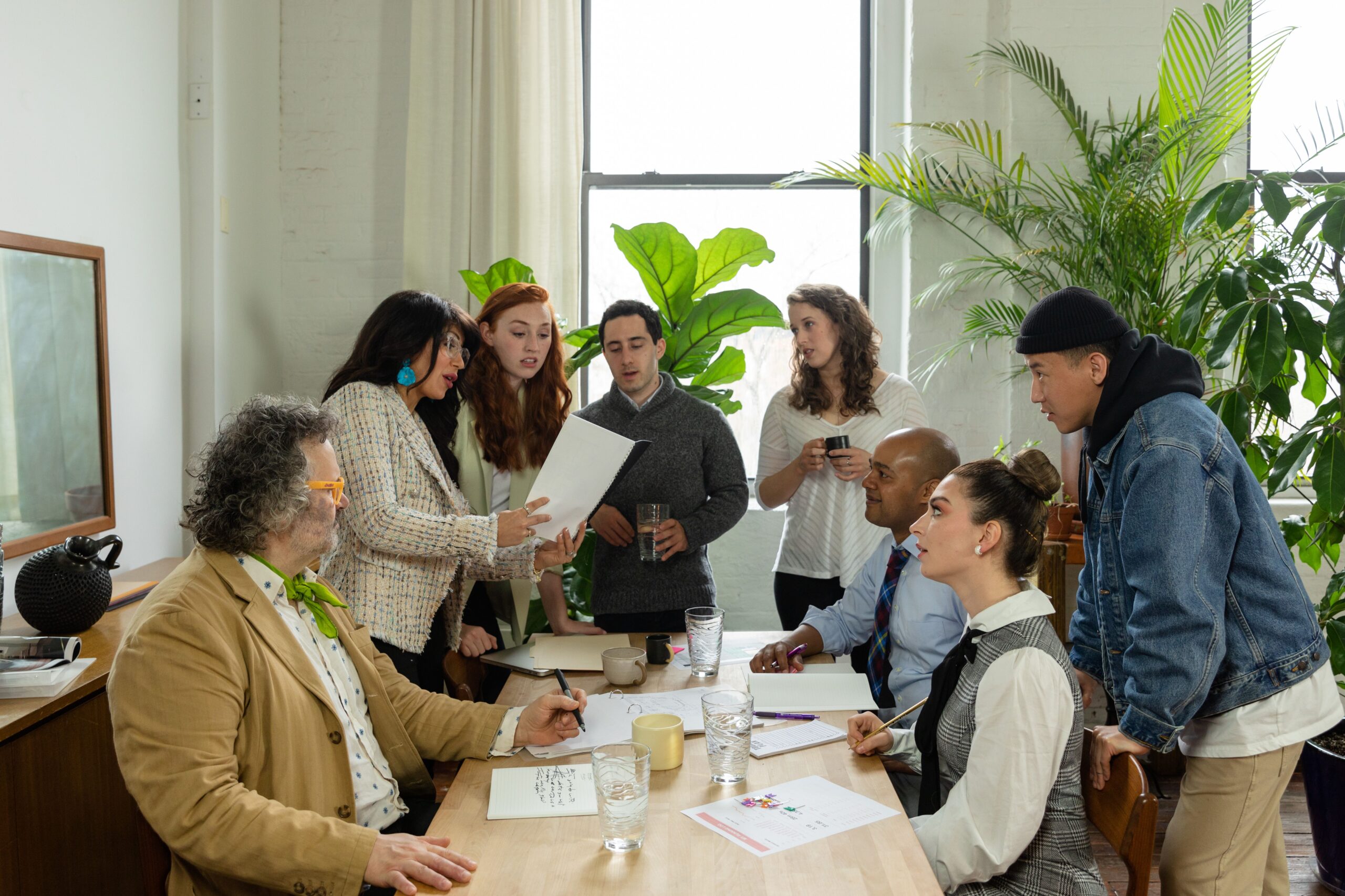 Diverse team discusses personal grievance reforms NZ around a conference table.