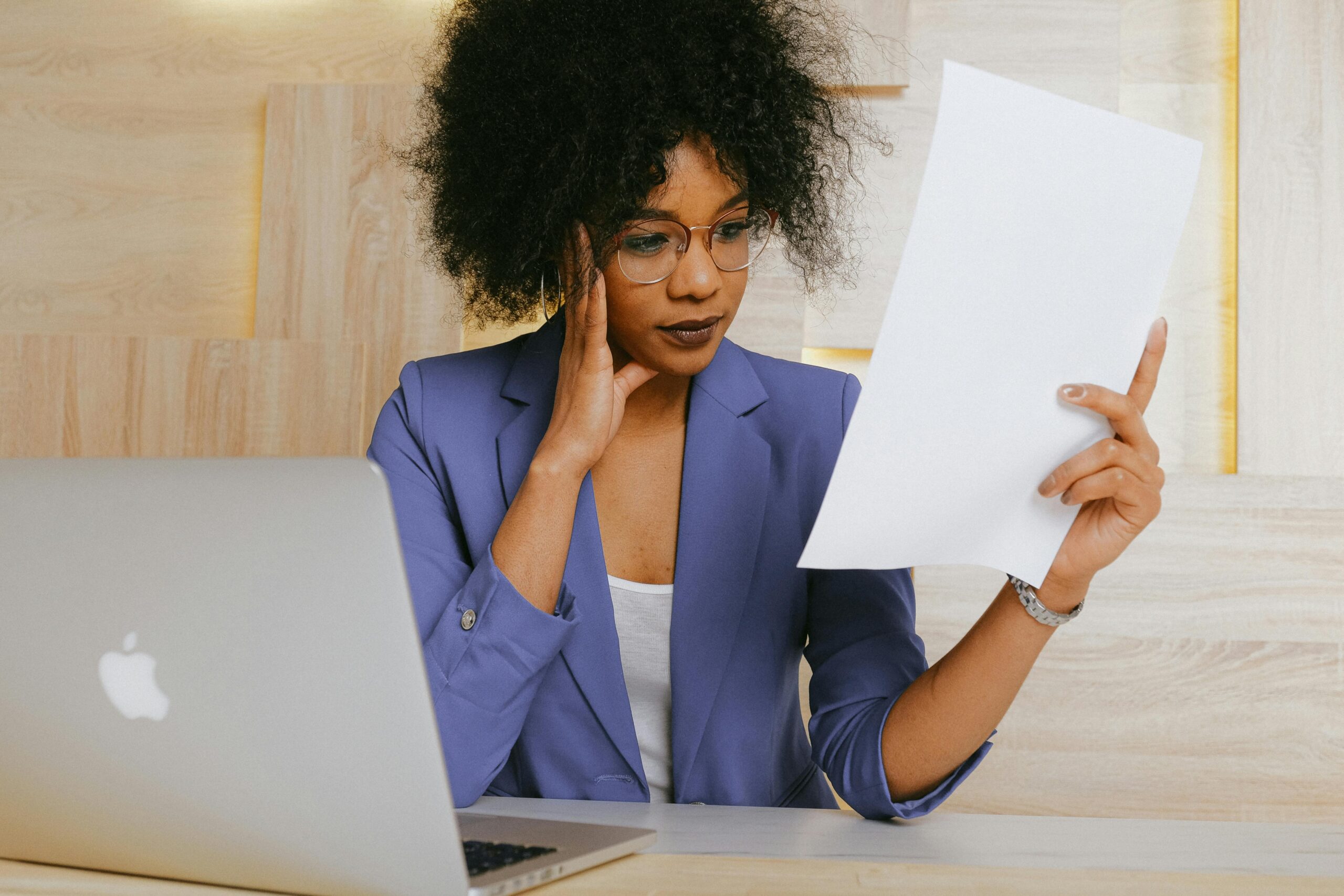Woman reviewing documents during an online policy service rollout